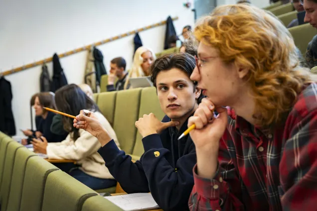 Students attending a lecture in a lecture hall.
